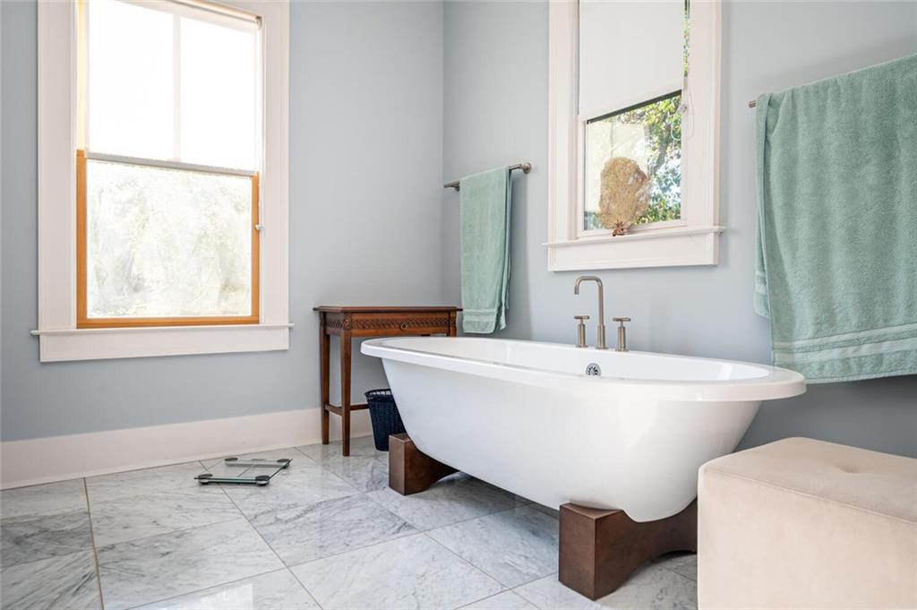 123 Ansley Street Decatur, GA 30030 - Photo 51 of 61 a spacious bathroom with a bathtub and window
