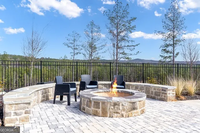 a view of a lake with furniture