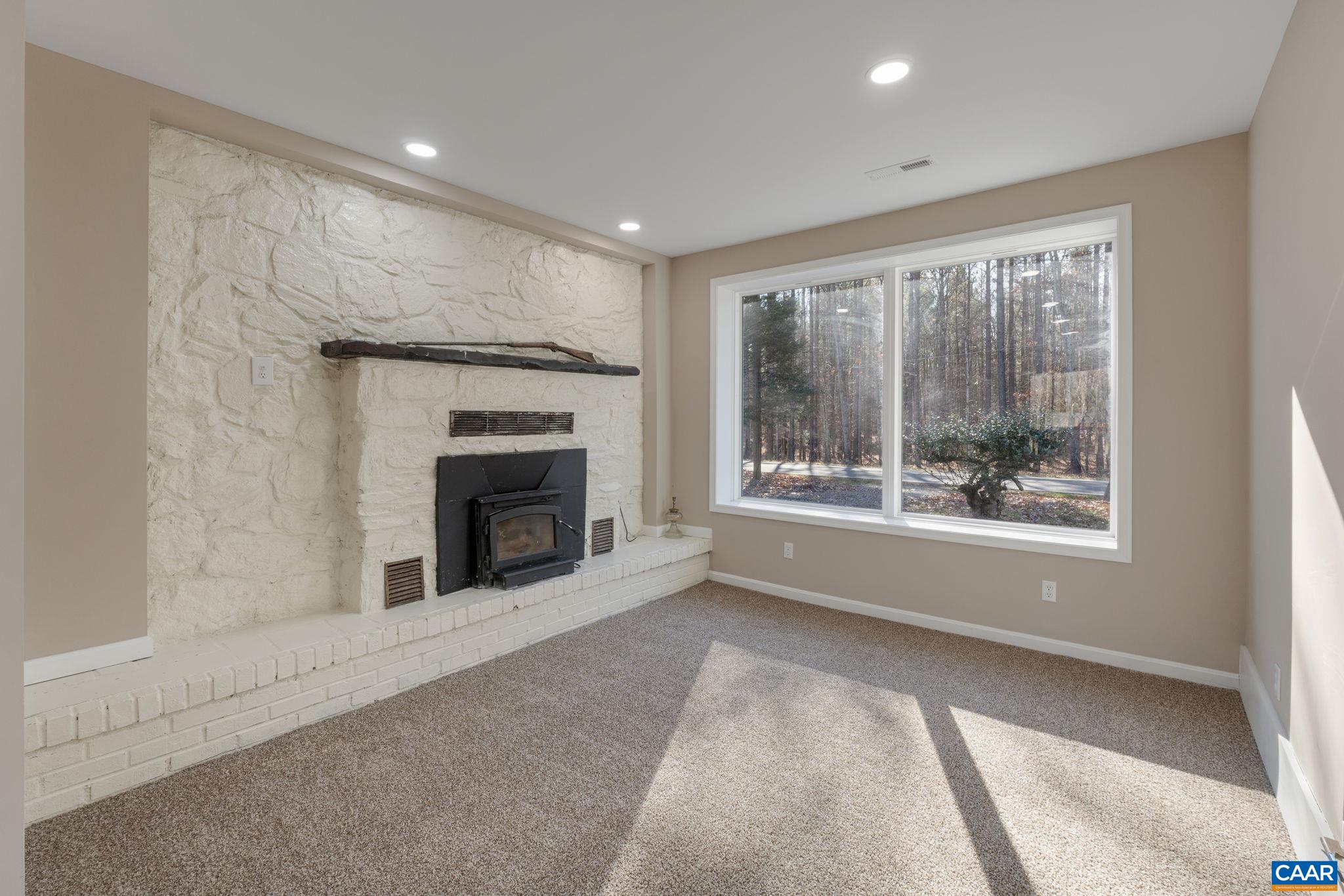 18503 Monrovia Road Orange, VA 22960 - Photo 13 of 39 a view of an empty room with window and fire place