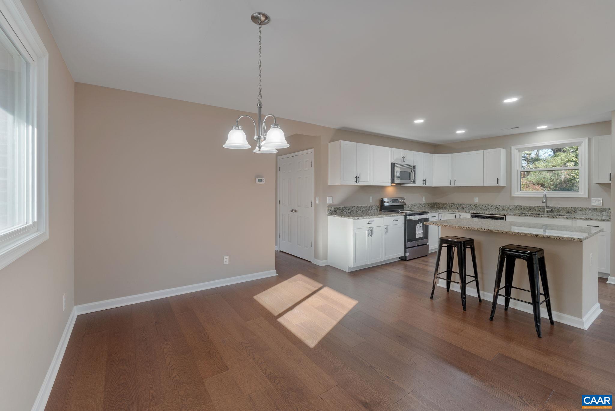 18503 Monrovia Road Orange, VA 22960 - Photo 19 of 39 a kitchen with stainless steel appliances granite countertop a stove a sink dishwasher and a refrigerator with wooden floor