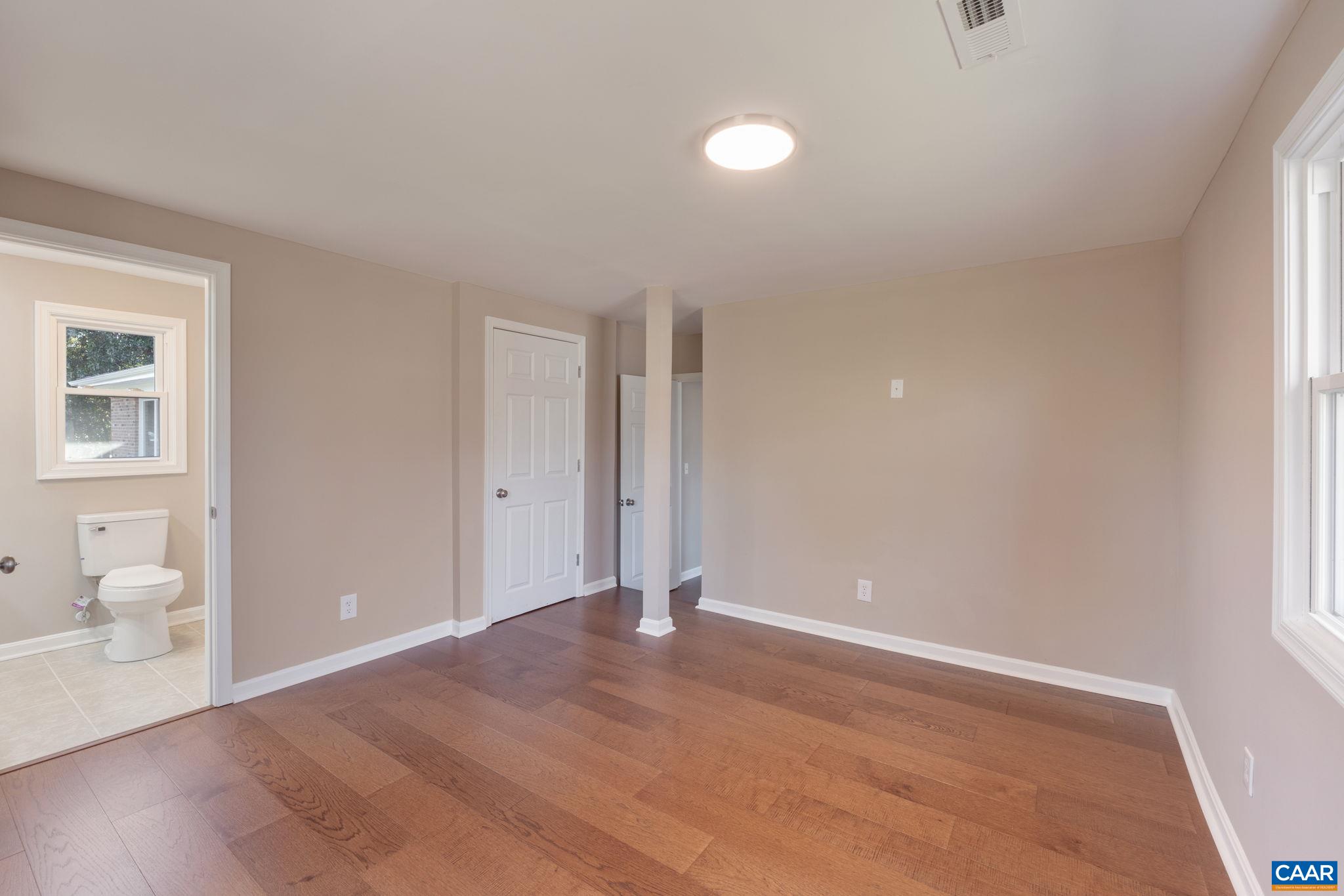18503 Monrovia Road Orange, VA 22960 - Photo 24 of 39 a view of a room with wooden floor and bathroom view