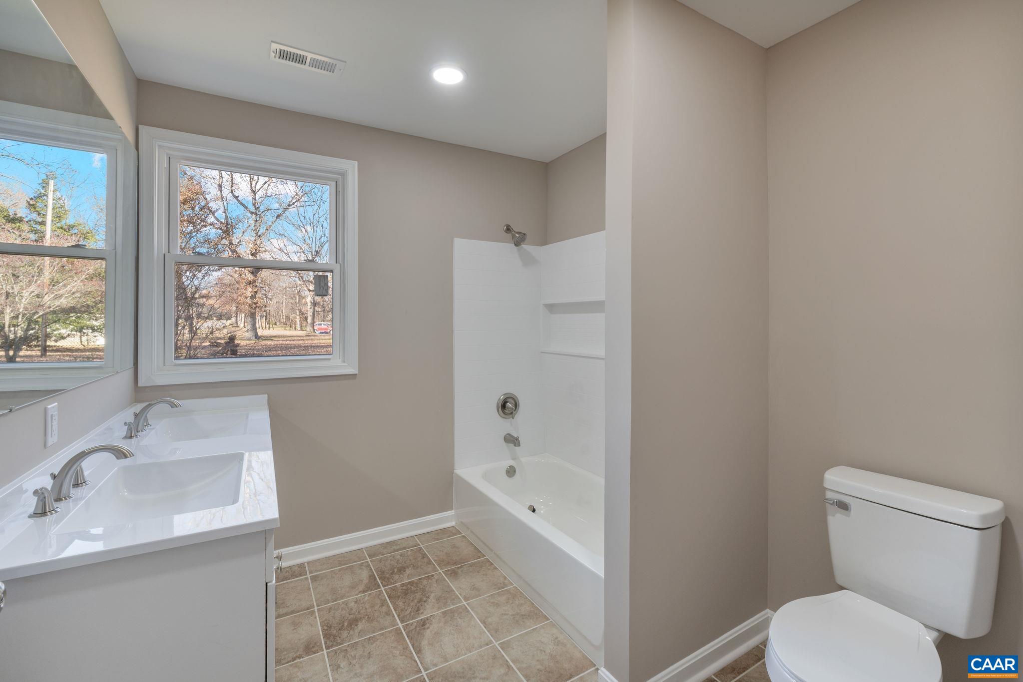 18503 Monrovia Road Orange, VA 22960 - Photo 33 of 39 a bathroom with a sink a toilet and shower
