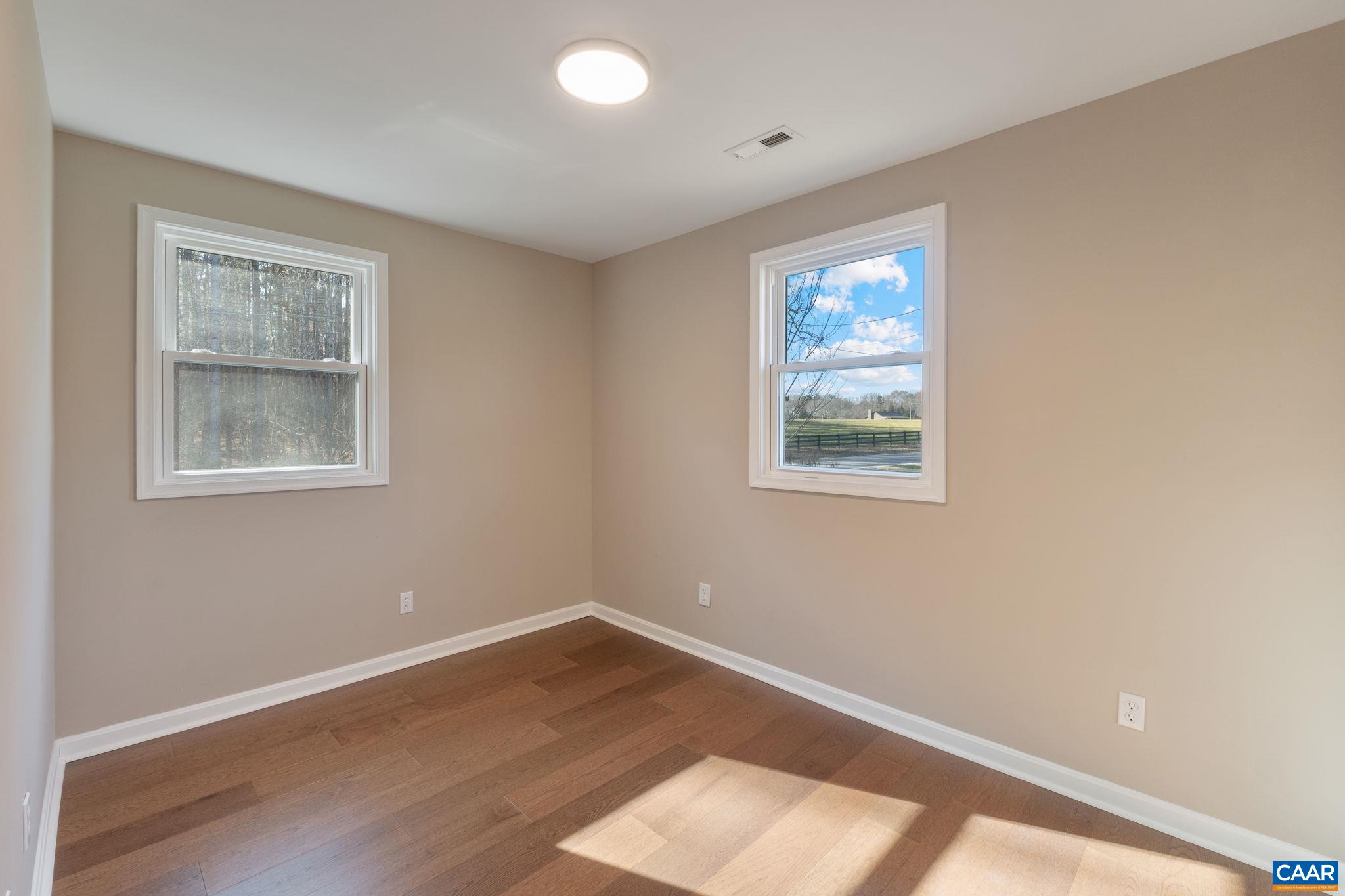 18503 Monrovia Road Orange, VA 22960 - Photo 35 of 39 a view of a big room with wooden floor and windows