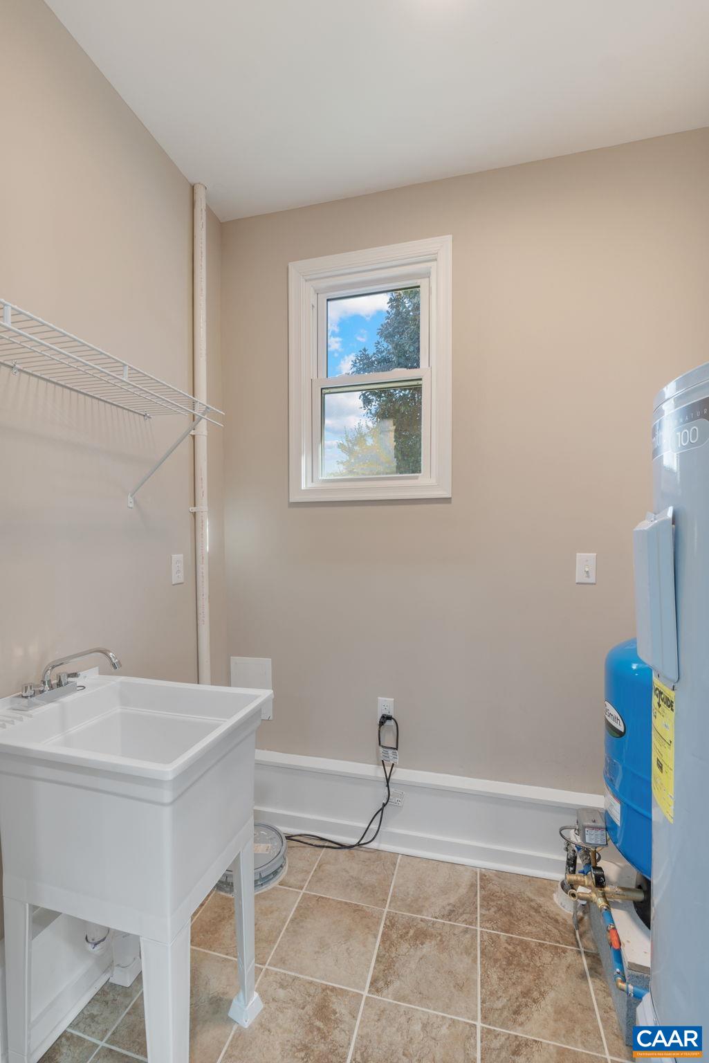18503 Monrovia Road Orange, VA 22960 - Photo 37 of 39 a bathroom with a sink a toilet and a mirror