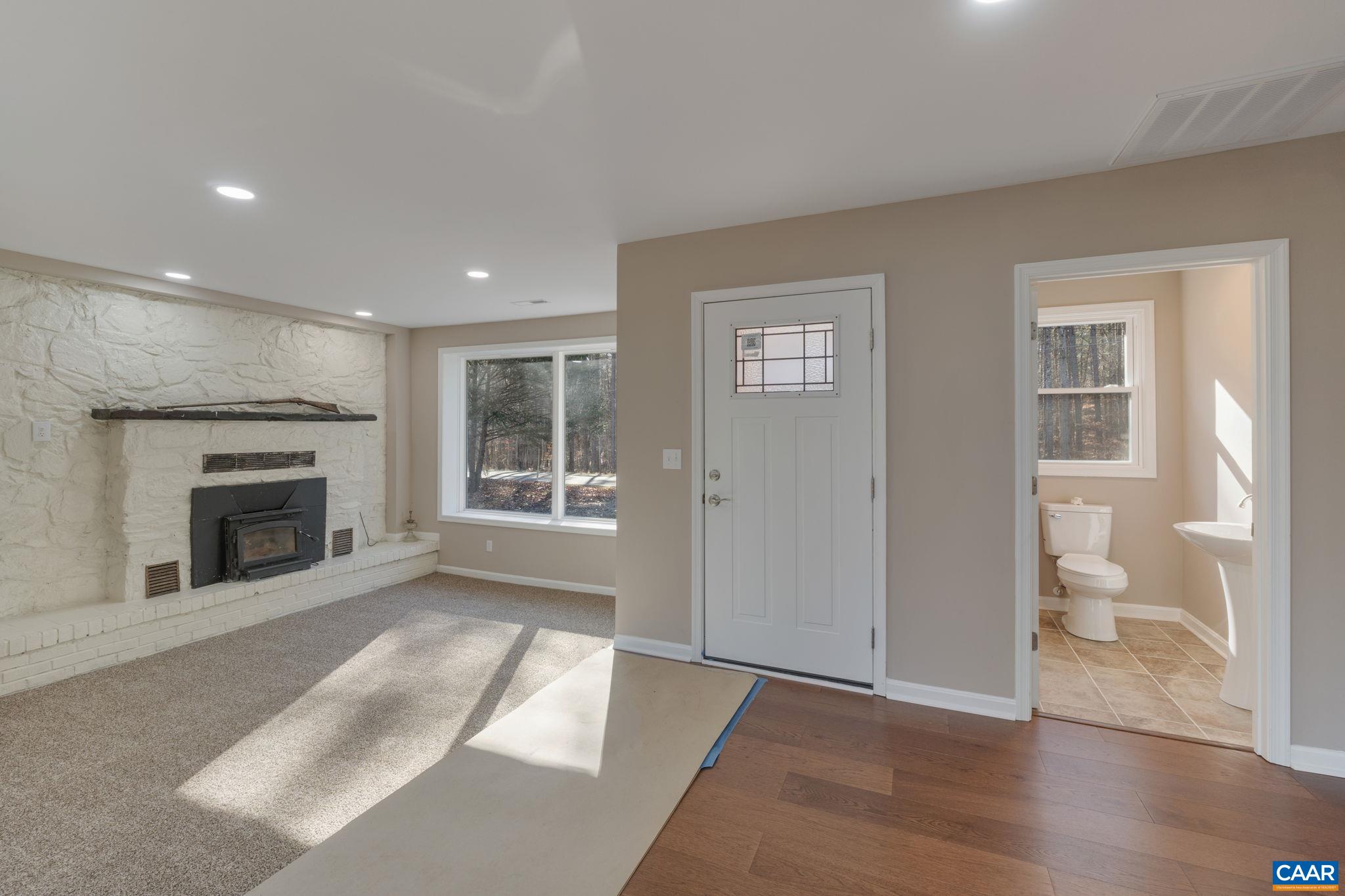 18503 Monrovia Road Orange, VA 22960 - Photo 10 of 39 an empty room with windows and fireplace