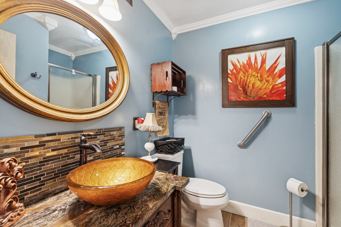 6303 Sullivan Road Lyles, TN 37098 - Photo 23 of 43 a bathroom with a toilet a sink and a mirror