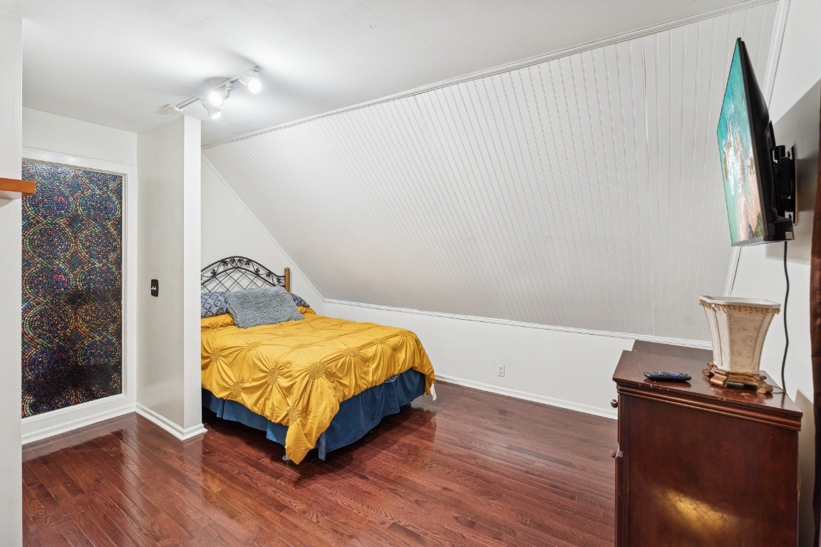 6303 Sullivan Road Lyles, TN 37098 - Photo 26 of 43 a bedroom with a bed and a flat screen tv