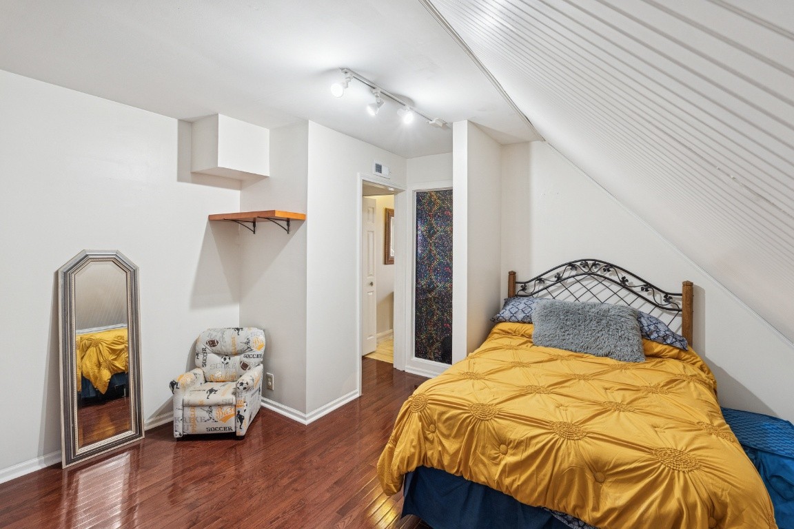 6303 Sullivan Road Lyles, TN 37098 - Photo 27 of 43 a bedroom with a bed and wooden floor