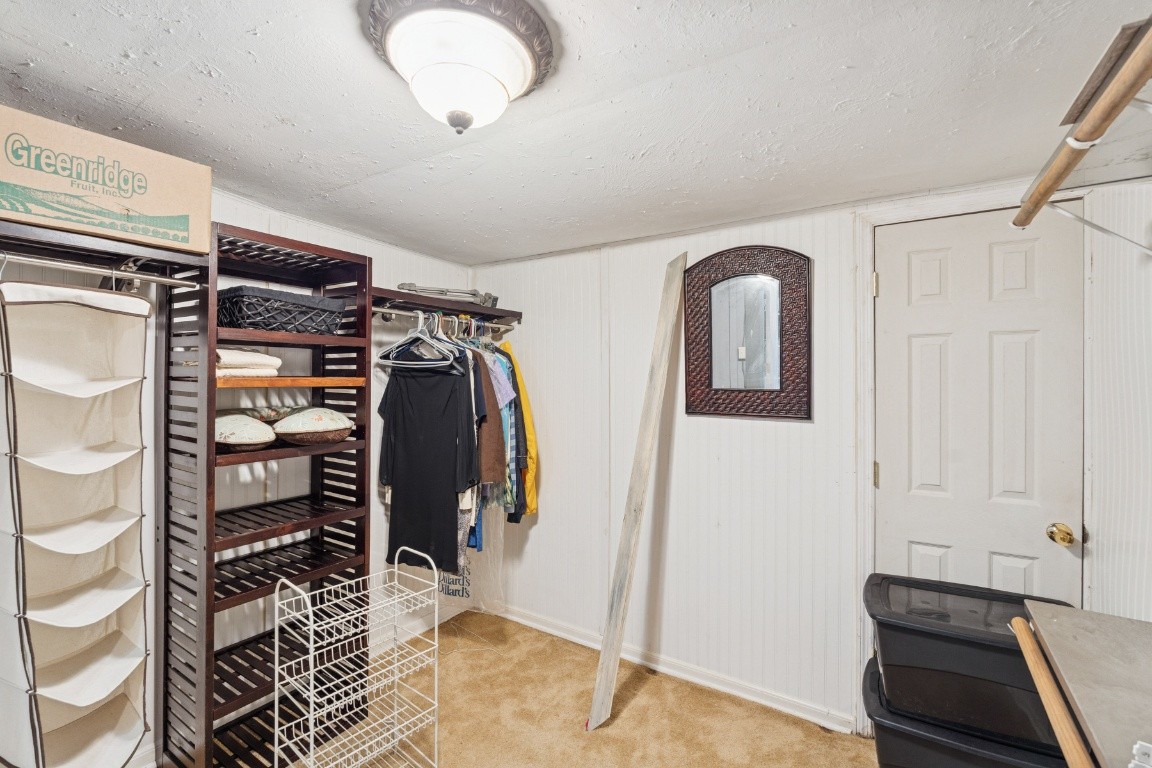 6303 Sullivan Road Lyles, TN 37098 - Photo 29 of 43 a view of walk in closet with clothes and shoes