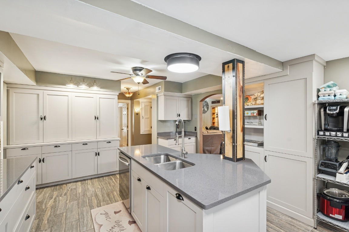 6303 Sullivan Road Lyles, TN 37098 - Photo 6 of 43 a kitchen with white cabinets and sink