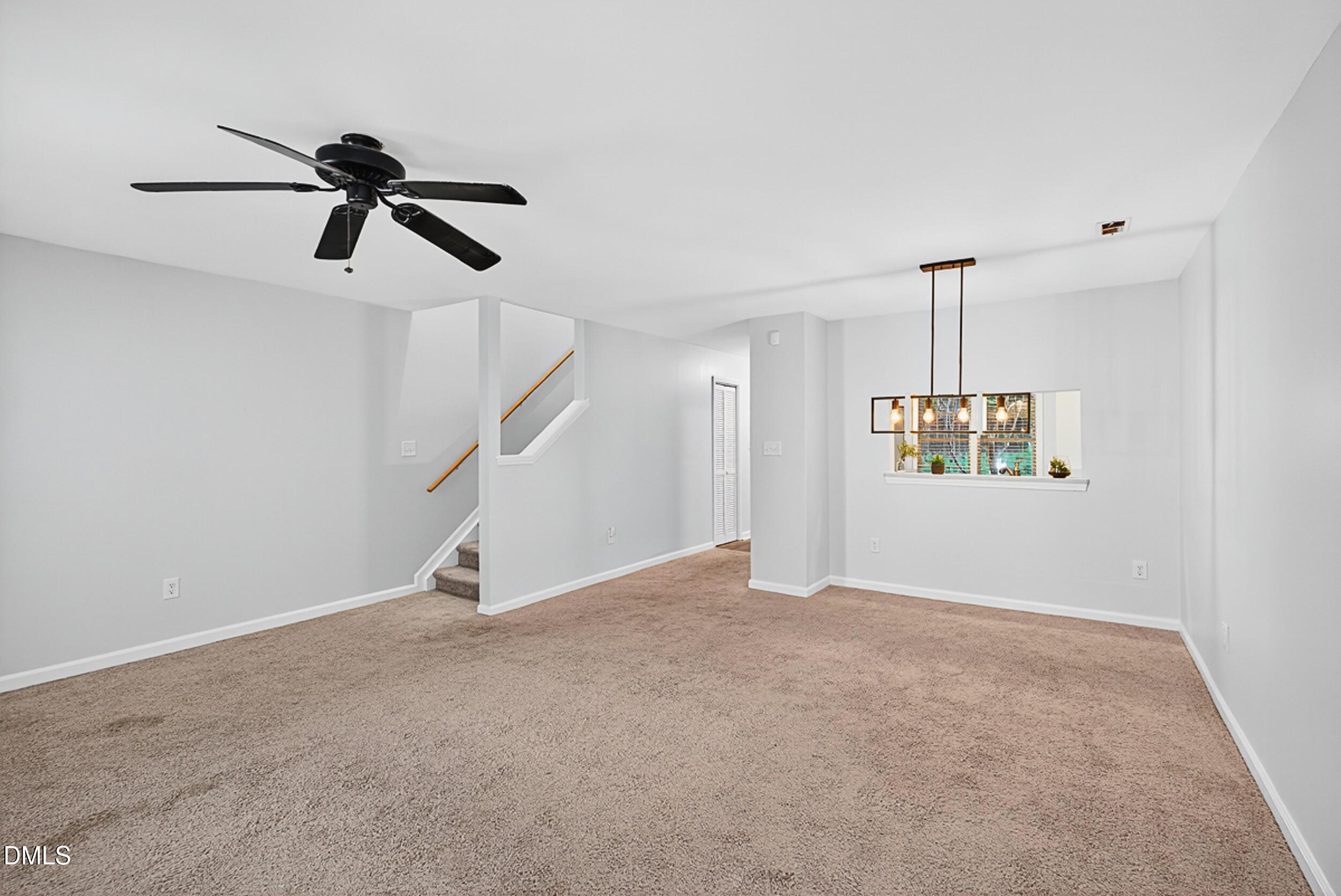 4617 Fawnbrook Circle Raleigh, NC 27612 - Photo 12 of 22 a view of an empty room with stairs