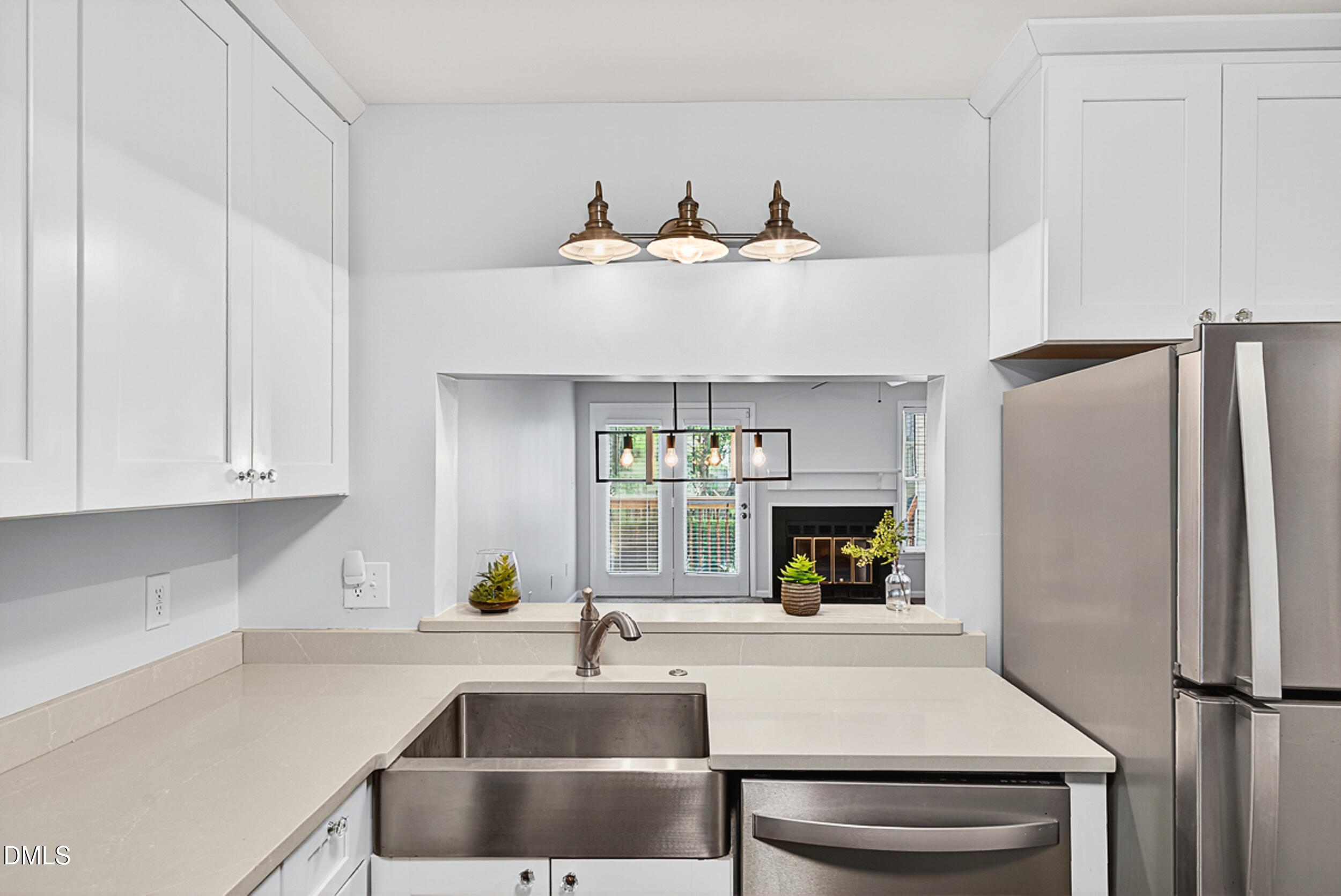 4617 Fawnbrook Circle Raleigh, NC 27612 - Photo 9 of 22 a kitchen with cabinets and a refrigerator