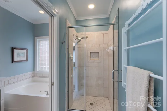 a bathroom with a shower and a sink