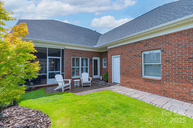 a backyard of a house with seating space