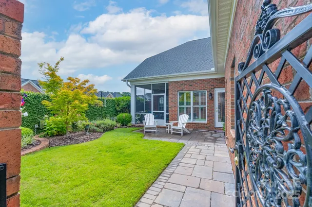 a front view of a house with garden and porch