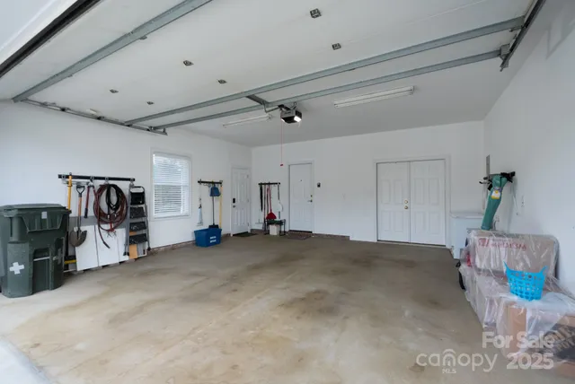 a view of a livingroom with furniture and a ceiling fan
