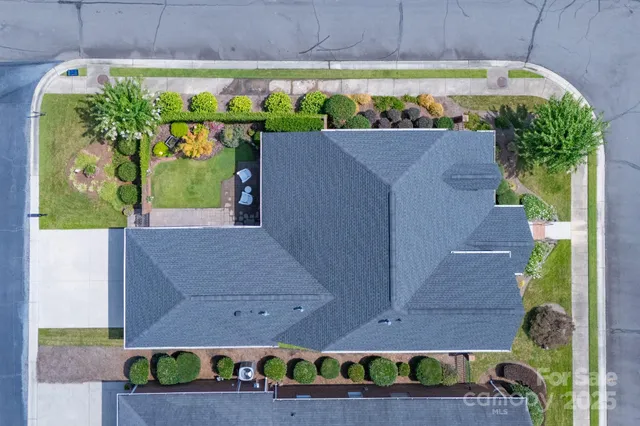 a aerial view of a house with a yard and plants