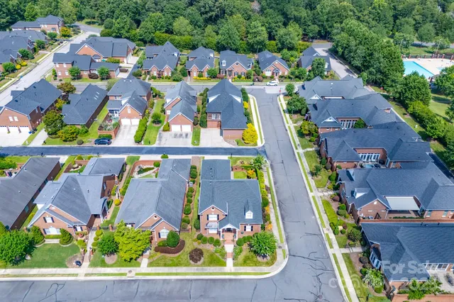 an aerial view of a city with lots of residential buildings