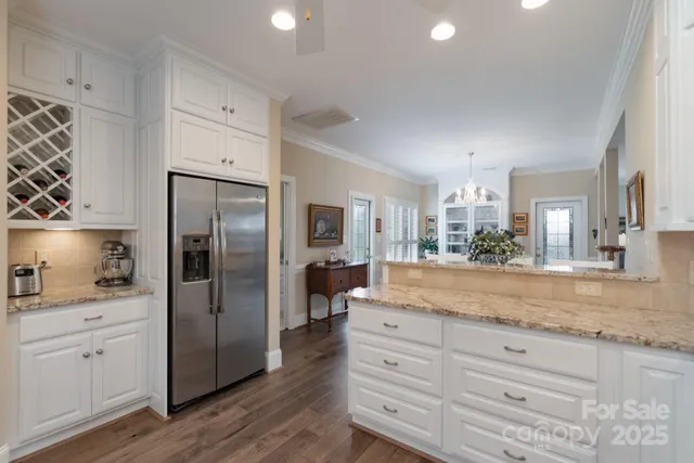a kitchen with counter top space cabinets and stainless steel appliances
