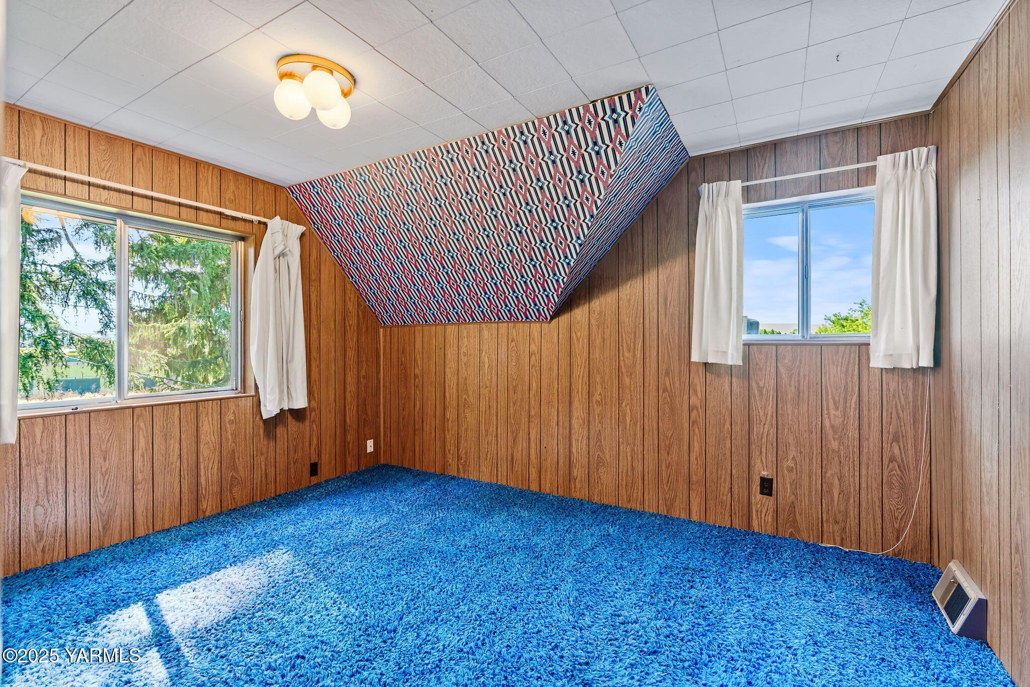 2006 Ekelman Road Yakima, WA 98901 - Photo 20 of 27 an empty room with a window and wooden floor