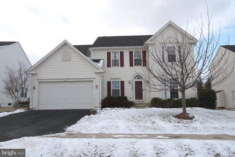 14208 Autumn Gold Road Boyds, MD 20841 - Photo 1 of 21 a front view of a house with a yard