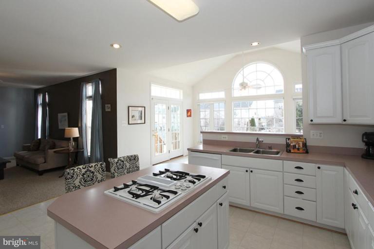 14208 Autumn Gold Road Boyds, MD 20841 - Photo 14 of 21 a kitchen with a stove a sink and a window