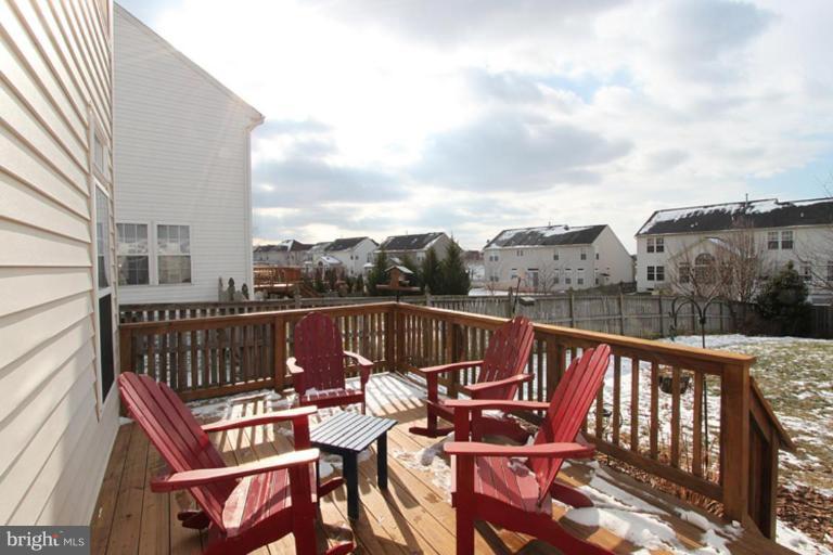 14208 Autumn Gold Road Boyds, MD 20841 - Photo 7 of 21 a view of a patio with a table and chairs