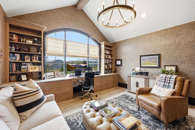 71 Farm Road Midway, UT 84049 - Photo 61 of 92 Vaulted ceiling office space featuring a large arched window, built-in cabinetry, wood-finish flooring, and a circular chandelier