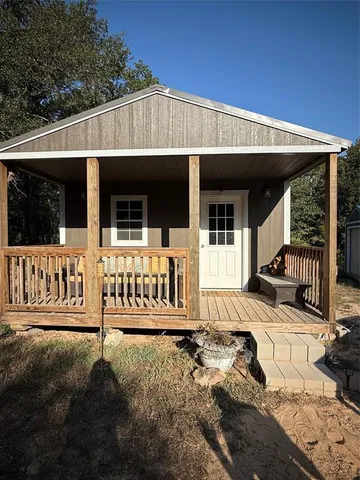 a living room with lots of furniture and a chandelier