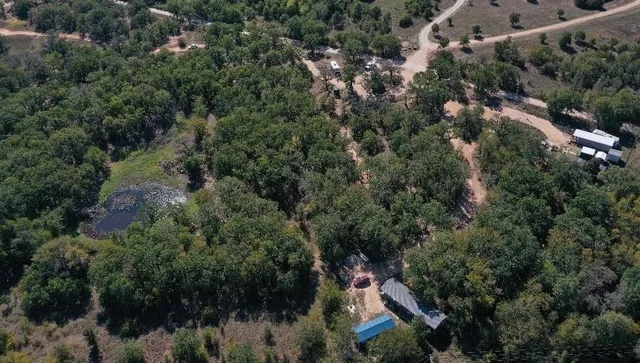 a backyard of a house with lots of green space