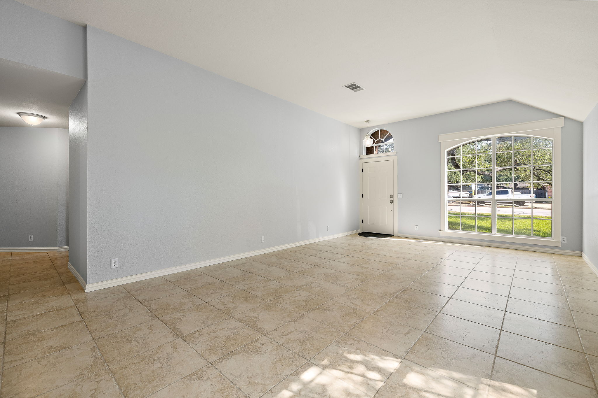 1102 Nelson Ranch Road Cedar Park, TX 78613 - Photo 4 of 37 A spacious entry area with tiled flooring and ample natural light from an arched window.