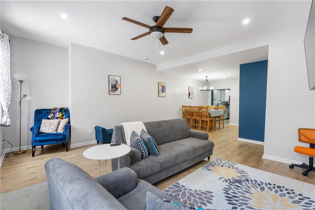 1015 Constance Street Pittsburgh, PA 15212 - Photo 12 of 25 a living room with furniture and a rug