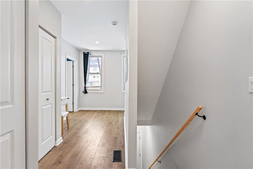 1015 Constance Street Pittsburgh, PA 15212 - Photo 13 of 25 a view of a hallway with wooden floor and stairs