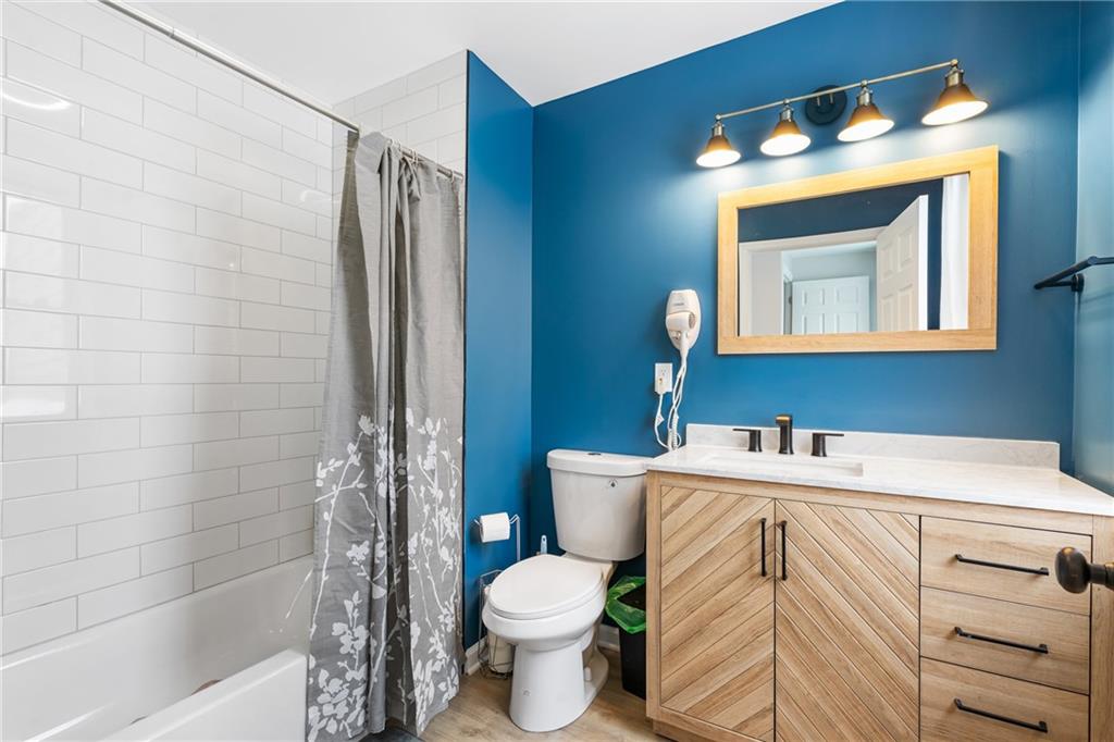 1015 Constance Street Pittsburgh, PA 15212 - Photo 21 of 25 a bathroom with a sink toilet vanity and shower