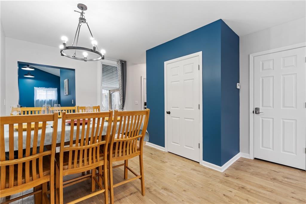 1015 Constance Street Pittsburgh, PA 15212 - Photo 9 of 25 a view of a dining room with furniture wooden floor and chandelier