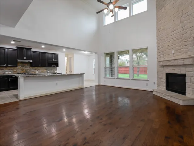 a view of a kitchen with a stove cabinets and a kitchen counter top