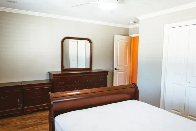 a bathroom with a sink a mirror and a window