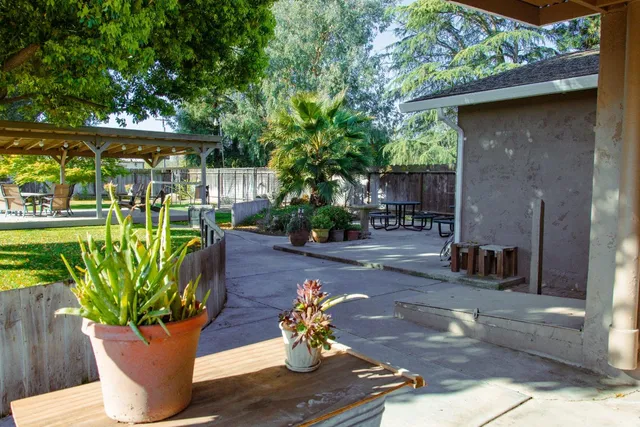 a view of a swimming pool with a patio