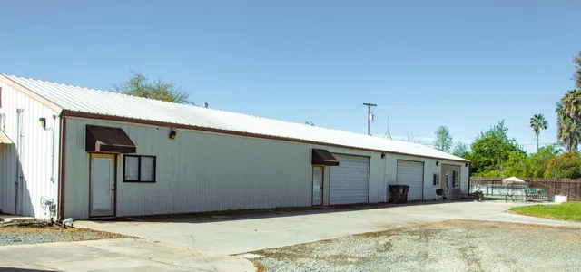 a view of a backyard with sitting area