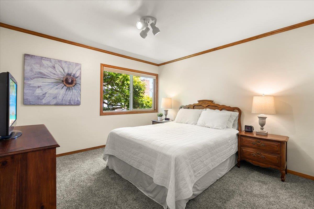 472 Helen Drive Millbrae, CA 94030 - Photo 17 of 35 a bedroom with a bed and a flat screen tv