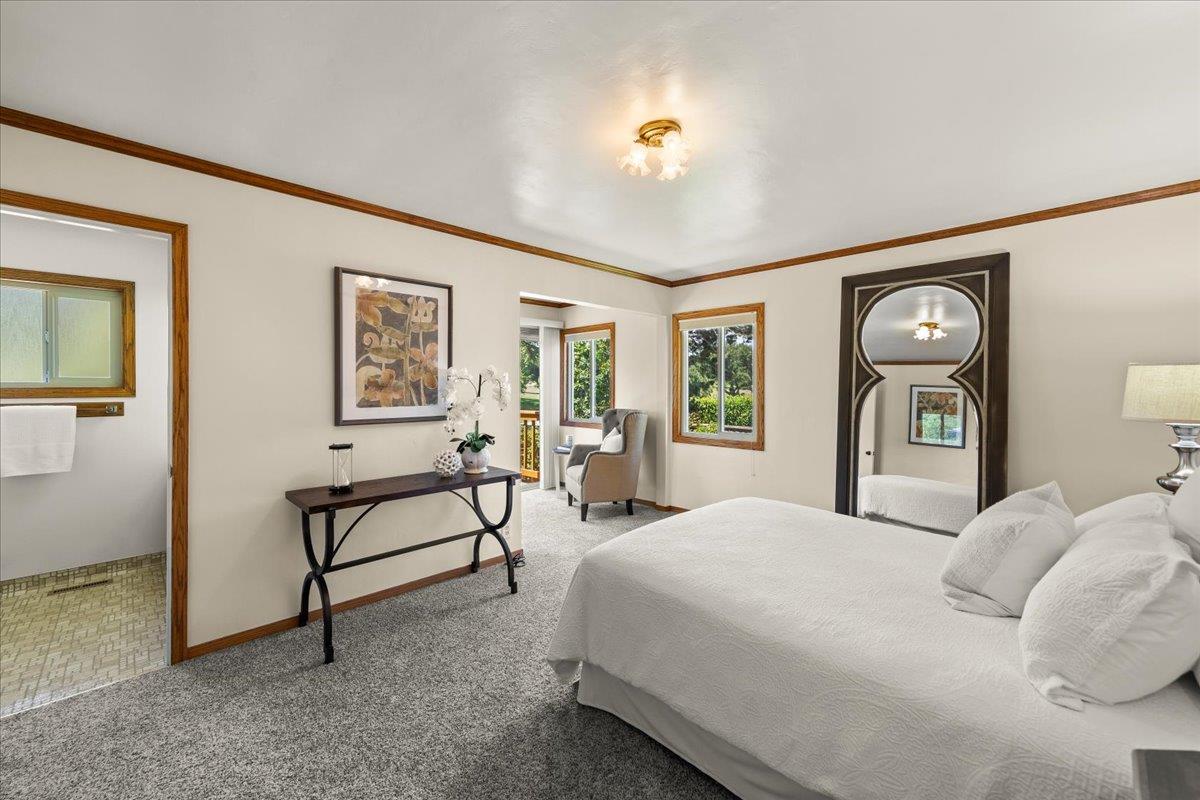 472 Helen Drive Millbrae, CA 94030 - Photo 21 of 35 a bedroom with a bed and a chandelier