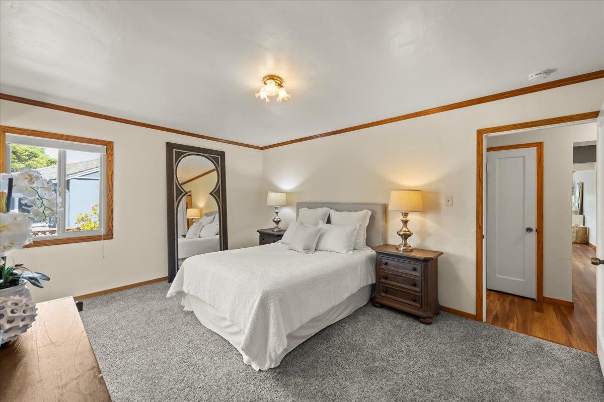 472 Helen Drive Millbrae, CA 94030 - Photo 22 of 35 a bedroom with a bed and a painting on the wall
