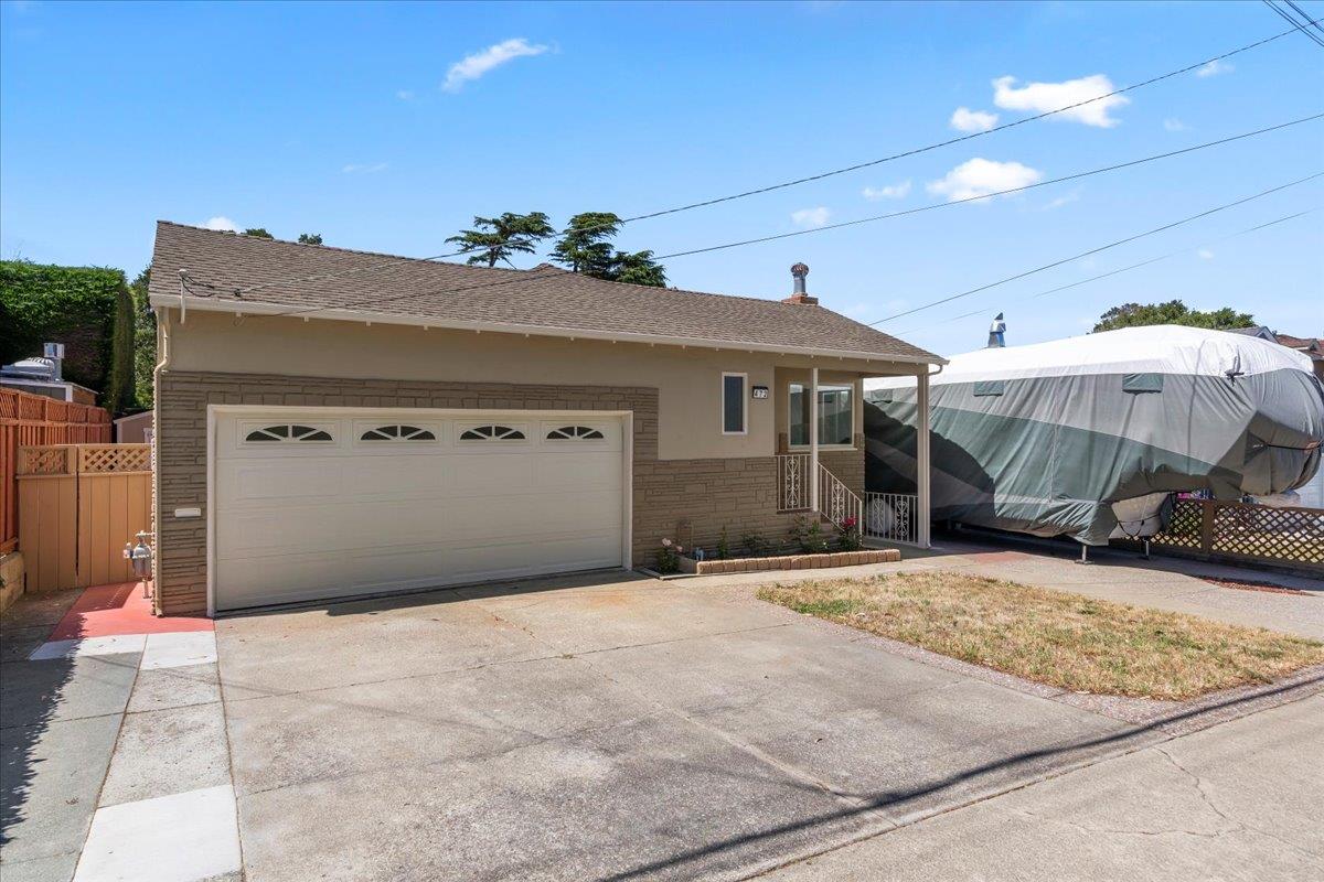 472 Helen Drive Millbrae, CA 94030 - Photo 3 of 35 a front view of a house with a yard and garage