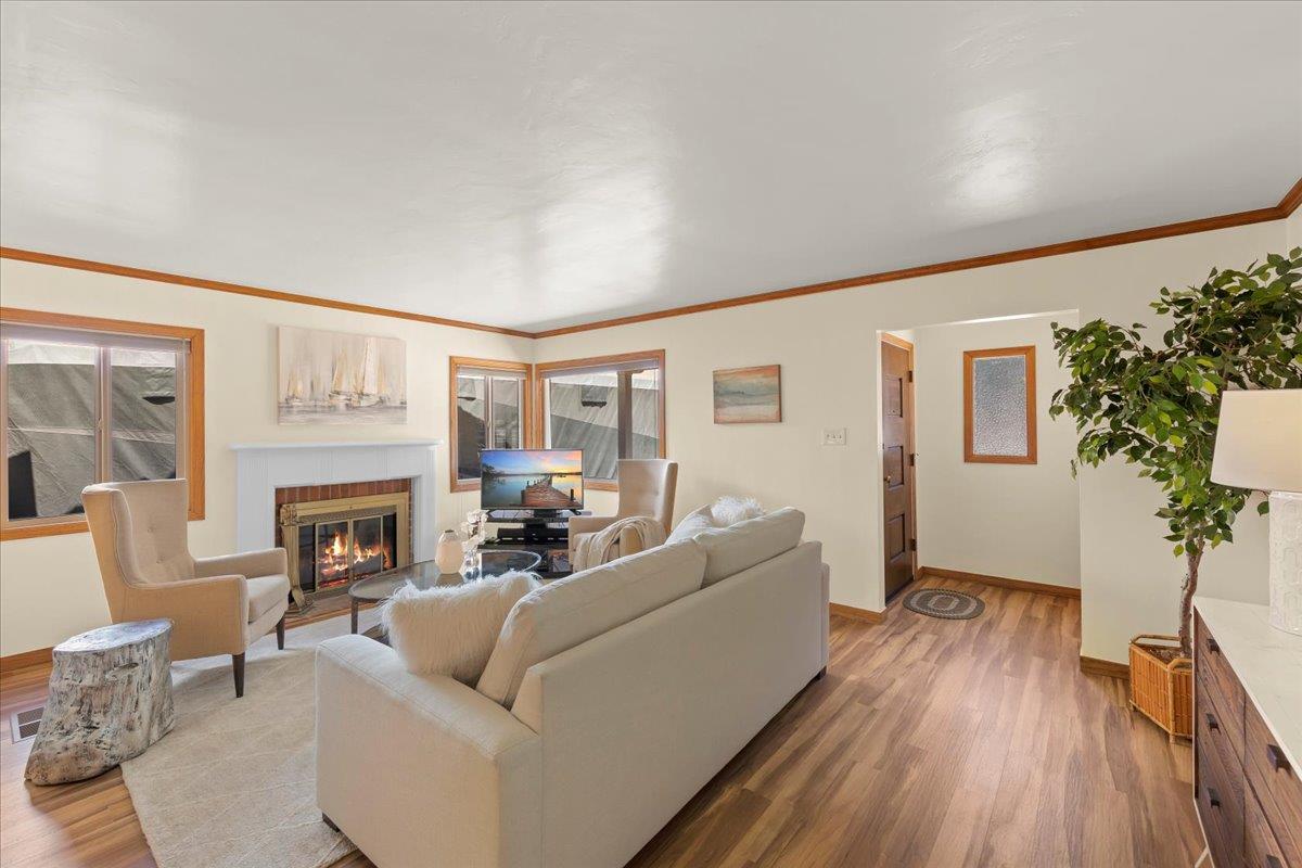 472 Helen Drive Millbrae, CA 94030 - Photo 7 of 35 a living room with furniture a fireplace and a potted plant