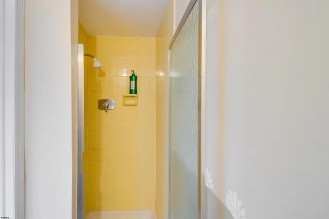 a view of a bathroom from a hallway