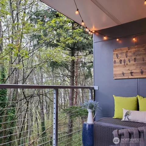 a view of a balcony with furniture