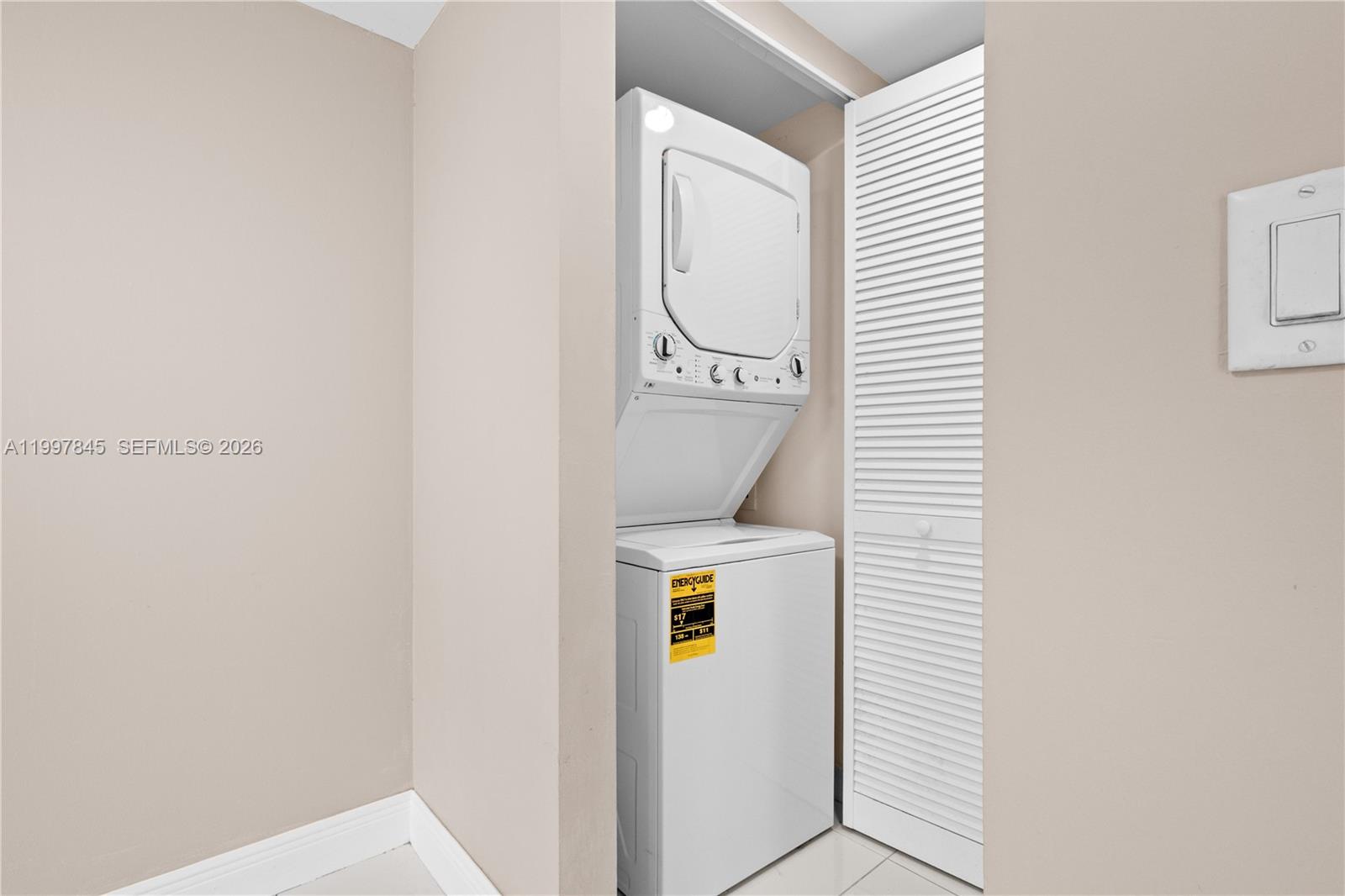 6211 Southwest 138th Court, Unit B Miami, FL 33183 - Photo 10 of 27 a utility room with dryer and washer