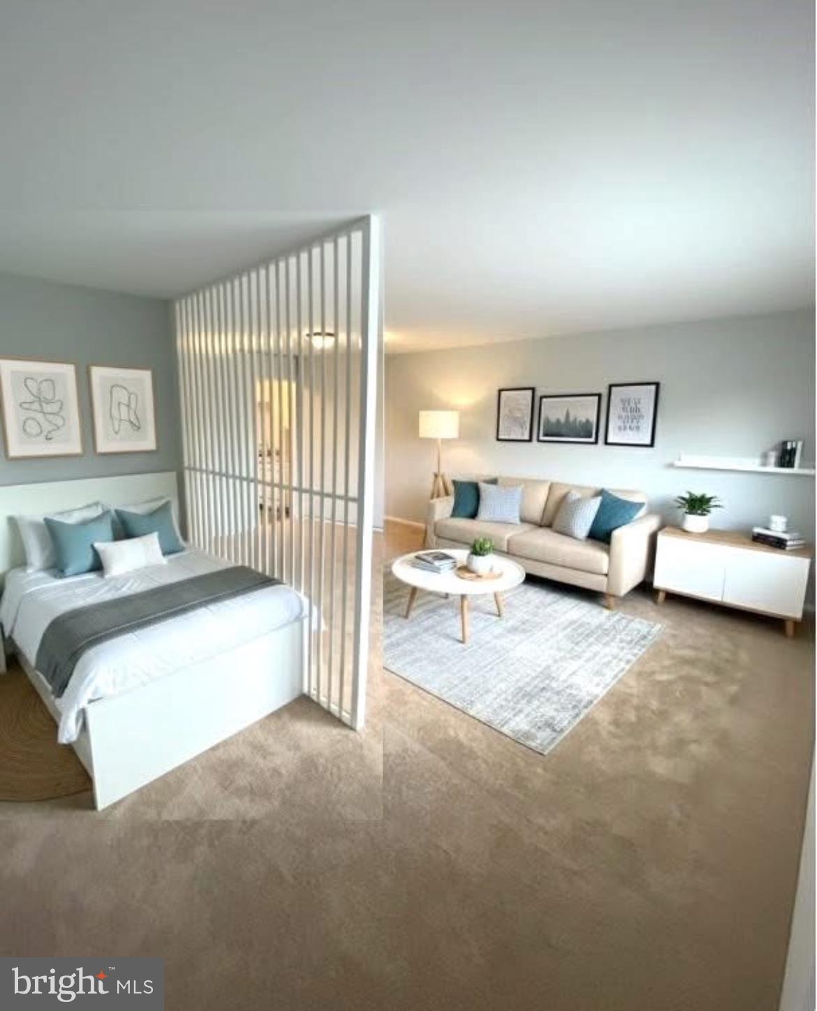 1111 University Boulevard West, Unit 501A Silver Spring, MD 20902 - Photo 2 of 13 a spacious bedroom with a bed and a couch