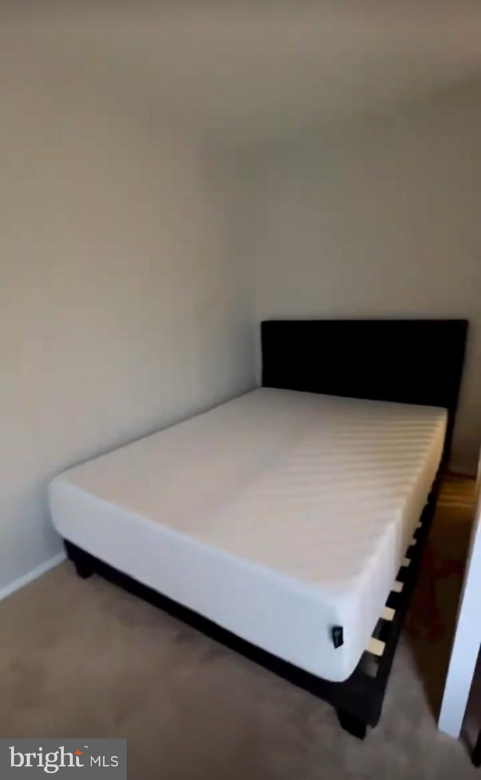 1111 University Boulevard West, Unit 501A Silver Spring, MD 20902 - Photo 7 of 13 a room with a bed