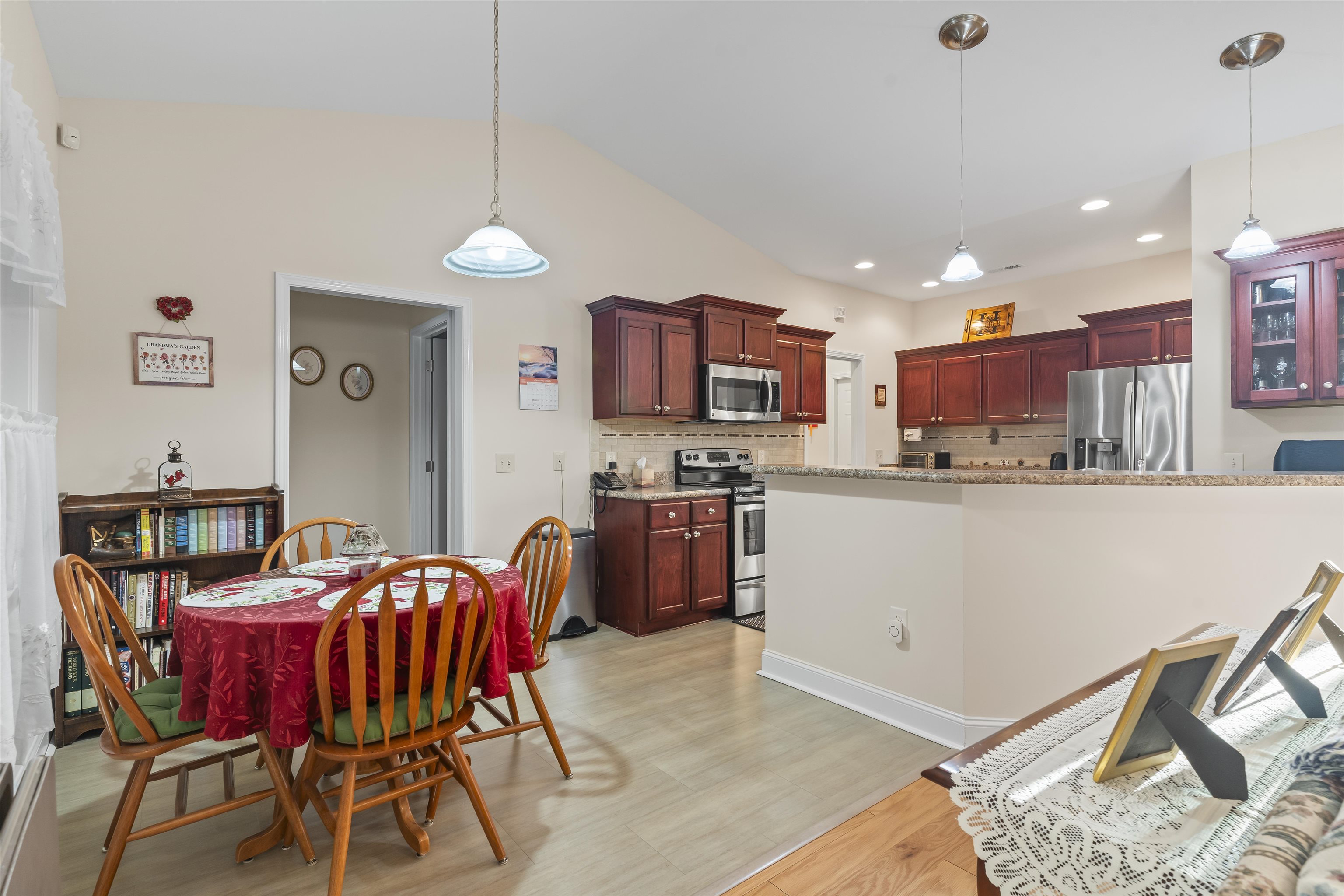 830 Payne Court Conway, SC 29526 - Photo 15 of 38 Dining space with light wood-style floors and lofted ceiling